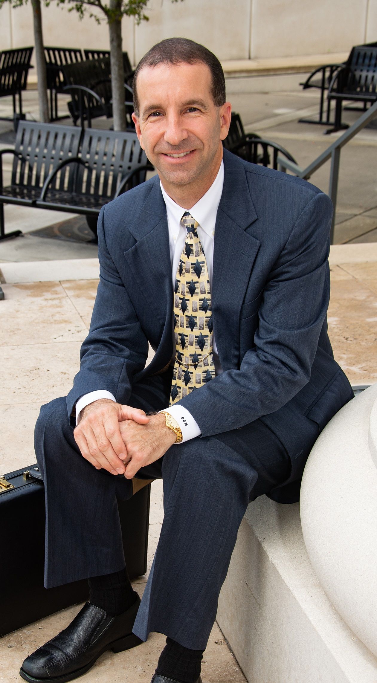 Christian Attorney Jacksonville Florida | Attorney Blane McCarthy sitting by a pillar at the Jacksonville courthouse